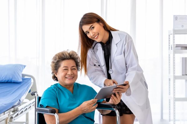 asian-medical-doctor-take-care-explain-senior-elderly-woman-female-patient-wheelchair-with-tablet-looking-camera_554837-54